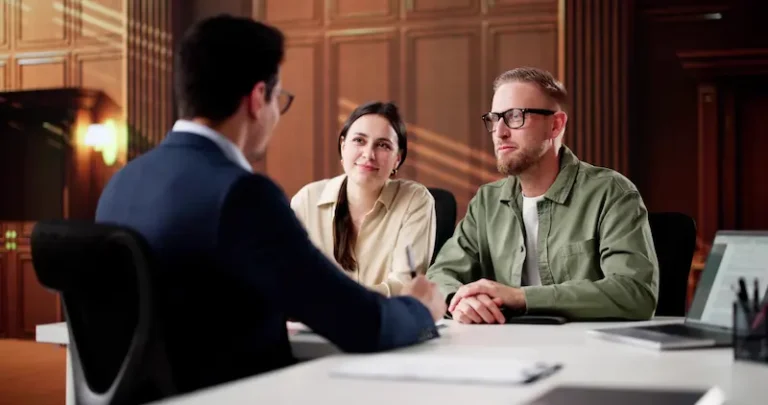 An agreeable couple speak with a lawyer about an uncontested divorce.