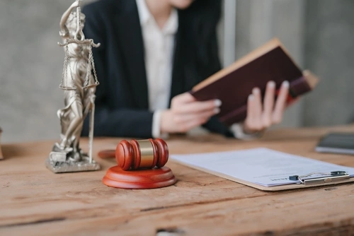 A lawyer reviews documents for a joint mortgage in a divorce in Texas.